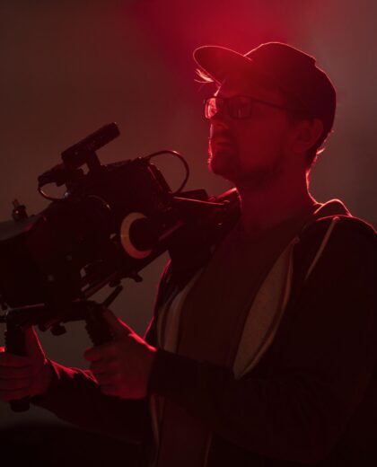 man-filming-with-professional-camera
